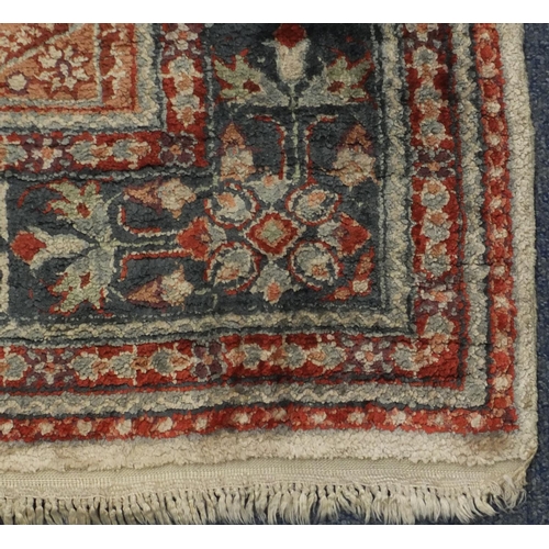 2085 - Chinese Persian design silk rug, the ivory central field having a flower head design within correspo... 