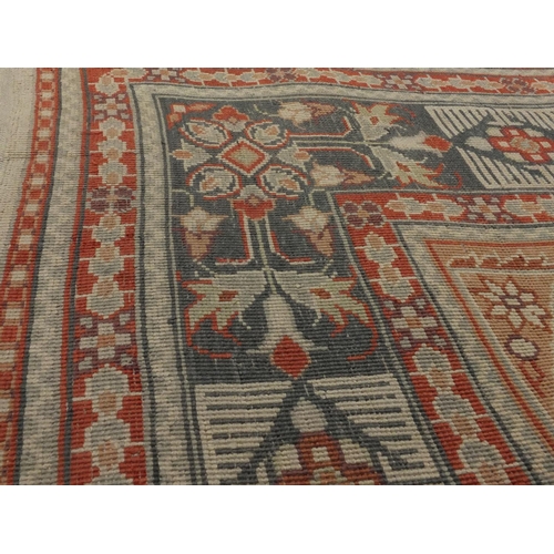 2085 - Chinese Persian design silk rug, the ivory central field having a flower head design within correspo... 
