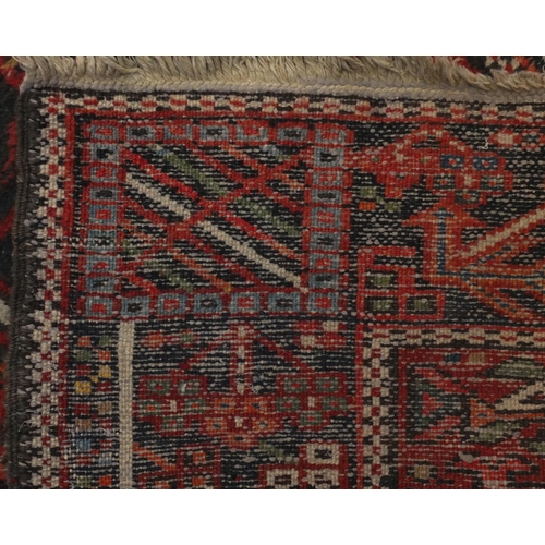 2127 - Rectangular Persian Heriz carpet runner, the central field having a stylised repeat flower head desi... 