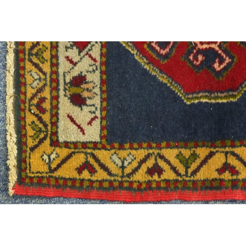 2152 - Two Turkish Yastik rugs, each approximately 100cm x 48cm