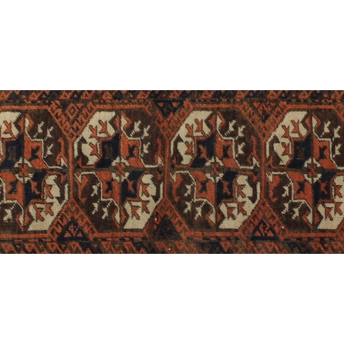 2117 - Rectangular Persian Baluch Bakahra design rug, the central field having a repeat flower head design,... 