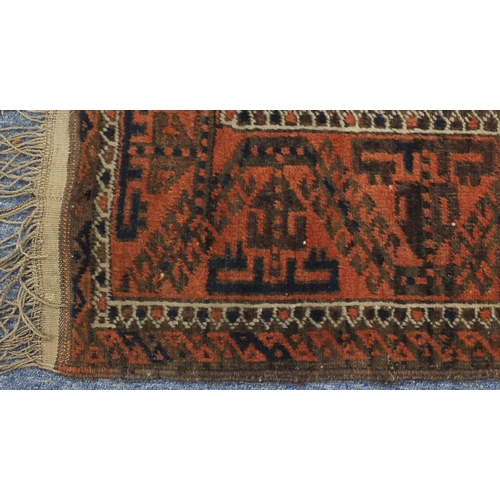 2117 - Rectangular Persian Baluch Bakahra design rug, the central field having a repeat flower head design,... 