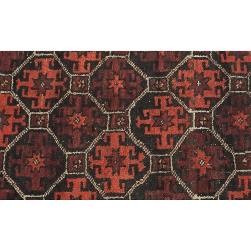 2137 - Rectangular Persian Baluch rug, the central field having an all over flower head design, 137cm x 89c... 