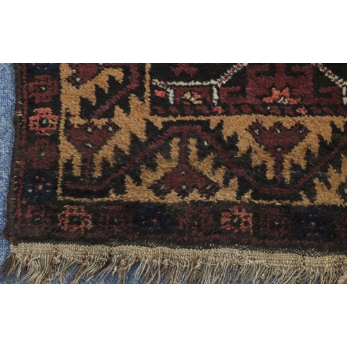 2137 - Rectangular Persian Baluch rug, the central field having an all over flower head design, 137cm x 89c... 