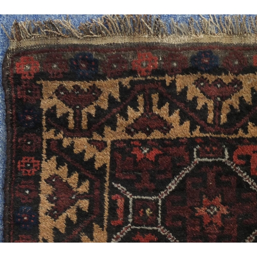 2137 - Rectangular Persian Baluch rug, the central field having an all over flower head design, 137cm x 89c... 