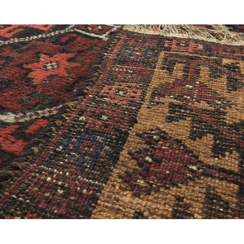 2137 - Rectangular Persian Baluch rug, the central field having an all over flower head design, 137cm x 89c... 