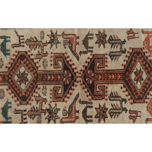 2125 - Rectangular South Persian rug, the central field having a camel and bird design within floral border... 