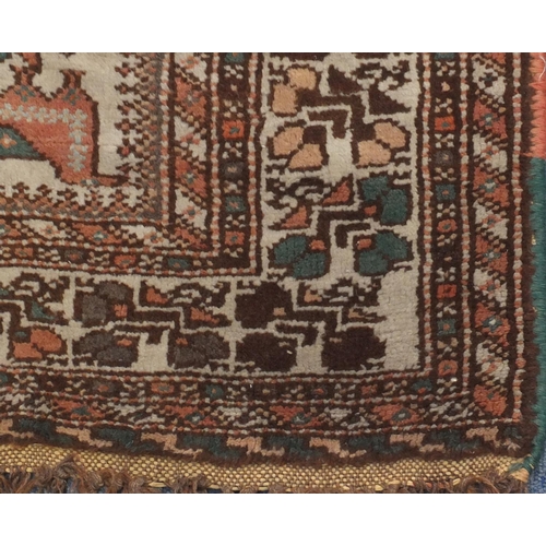 2125 - Rectangular South Persian rug, the central field having a camel and bird design within floral border... 