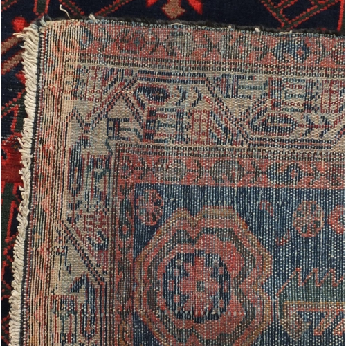 2135 - Rectangular Persian Melayer rug the central field having an all over floral design onto a midnight b... 