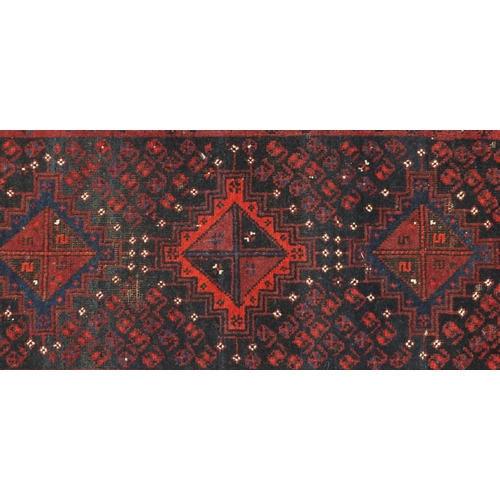 2148 - Rectangular Afghan Baluch rug having an all over stylised floral design within corresponding borders... 