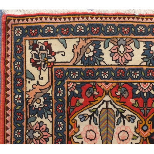 2084 - Rectangular Persian Bakhtiari rug, the central field having a garden design onto red ivory and midni... 