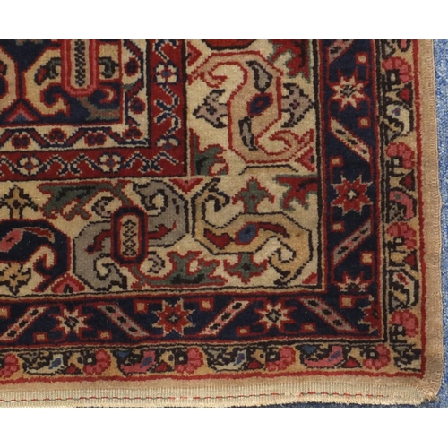 2073 - Rectangular Turkish rug, having all over stylised motifs and corresponding borders, 203cm x 113cm