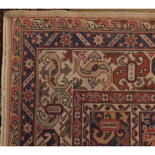 2073 - Rectangular Turkish rug, having all over stylised motifs and corresponding borders, 203cm x 113cm