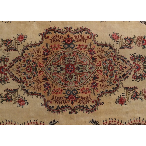 2043 - Rectangular Persian Tabriz carpet, the central field having foliate motifs onto an ivory ground with... 