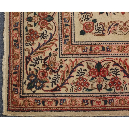 2043 - Rectangular Persian Tabriz carpet, the central field having foliate motifs onto an ivory ground with... 