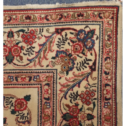 2043 - Rectangular Persian Tabriz carpet, the central field having foliate motifs onto an ivory ground with... 