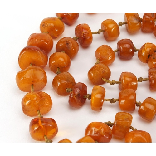3062 - Amber coloured bead necklace, 124cm in length, approximate weight  72.2g
