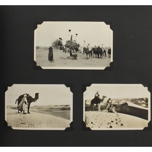 297A - Mostly early 20th century black and white photographs, some Military arranged in two albums includin... 