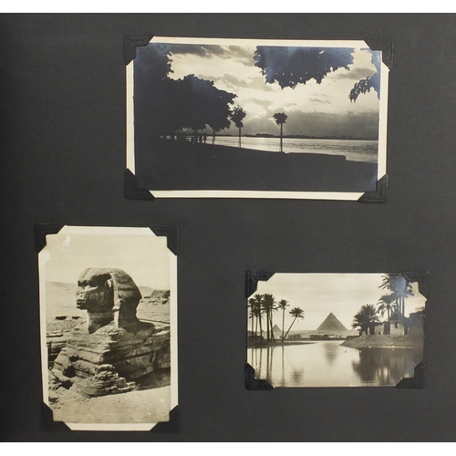 297A - Mostly early 20th century black and white photographs, some Military arranged in two albums includin... 