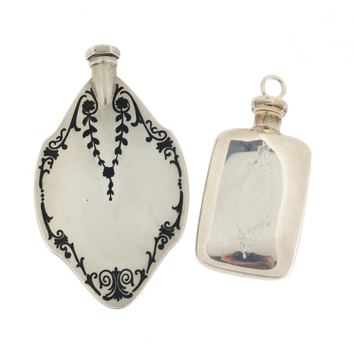 2863A - Two sterling silver scent bottles one with black enamel decoration, the largest 7cm in length, appro... 