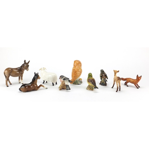 2566 - Nine Beswick animals including an owl, bullfinch and a fox, the largest 12cm high