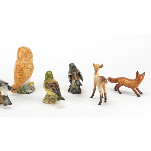 2566 - Nine Beswick animals including an owl, bullfinch and a fox, the largest 12cm high