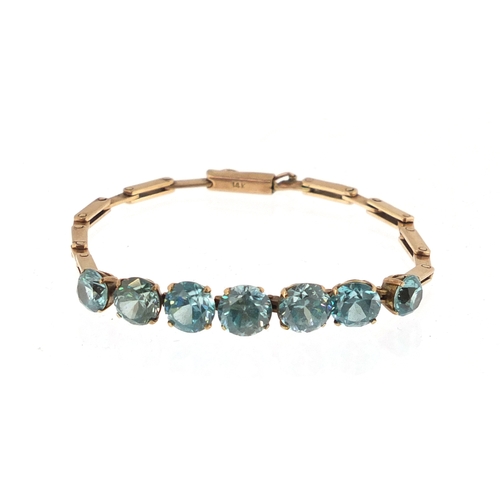 936 - 14ct gold graduated blue zircon bracelet, 15cm in length, approximate weight 8.8g