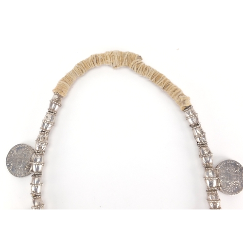 624 - Tribal interest Omani Thaler necklace with circular engraved pendant, the pendant 12cm high, approxi... 