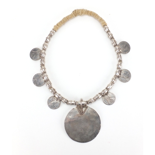 624 - Tribal interest Omani Thaler necklace with circular engraved pendant, the pendant 12cm high, approxi... 