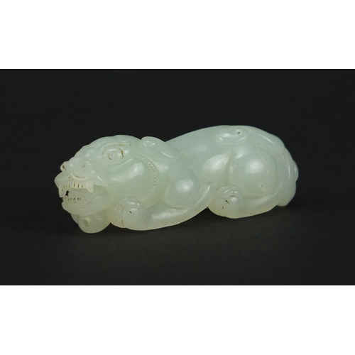 525 - Good Chinese pale celadon jade carving of a Foo Dog, 5.5cm in length