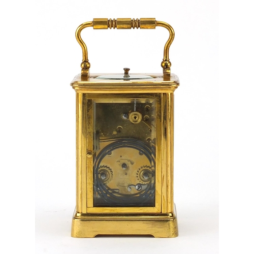 2221 - Brass cased repeating carriage clock striking on a gong retailed by Dent of London, the enamelled di... 