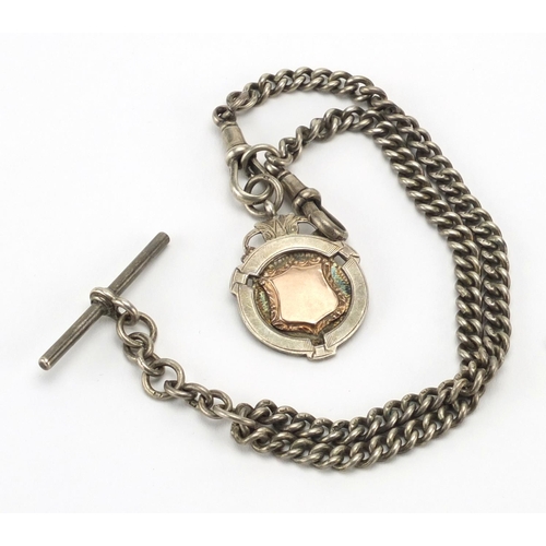 2861 - Silver flanked folding pocket knife and silver watch chain with sports jewel, approximate weight 60.... 