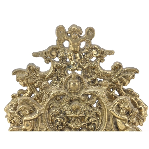 2472 - Victorian style brass desk stand with inkwells and letter rack, decorated with putti, 19cm high