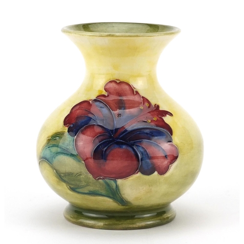 2198 - Moorcroft pottery baluster vase, hand painted with flower heads, 9.5cm high