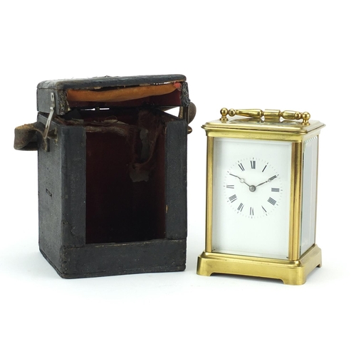 2267 - Large brass cased carriage clock with enamelled dial, roman numerals and travelling case, 13.5cm hig... 