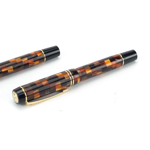 2713 - Unused Parker Duofold amber chequered three pen set, the smallest stamped sample, each with 18k gold... 