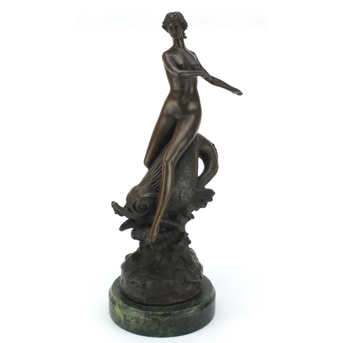 2178 - Large patinated bronze study of a nude Art Deco female upon a dolphin, raised on a circular green ma... 