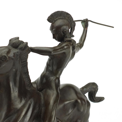 2183 - Patinated bronze study of a gladiator on horseback, raised on a rectangular black slate base, 38cm h... 