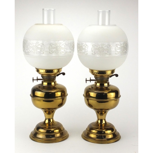 2378 - Pair of brass oil lamps with glass funnels and etched globular shades, each 51cm high