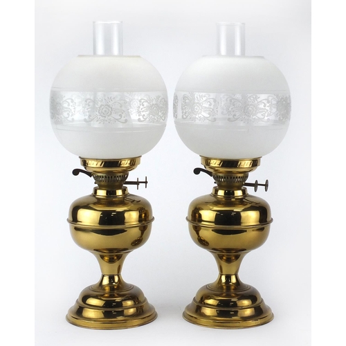 2378 - Pair of brass oil lamps with glass funnels and etched globular shades, each 51cm high