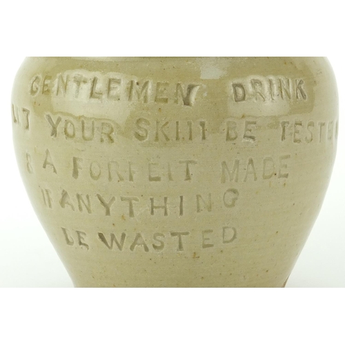 2431 - 19th century salt glazed puzzle jug with impressed motto, 'Gentleman drink and Let your skill be tes... 
