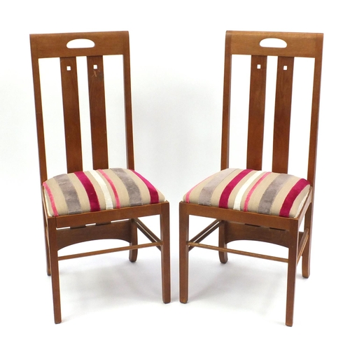 2079 - Pair of light oak Rennie Mackintosh chairs with striped stuff over upholstered seats, 106cm high