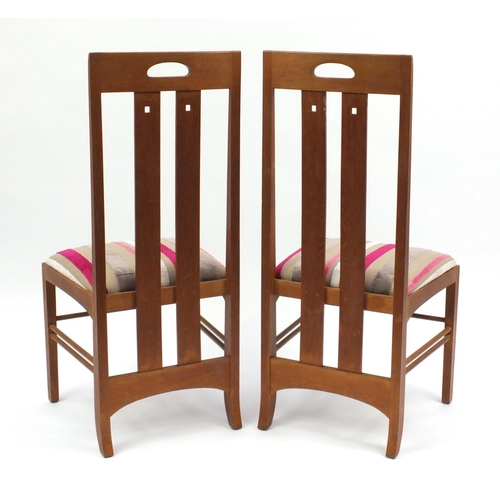 2079 - Pair of light oak Rennie Mackintosh chairs with striped stuff over upholstered seats, 106cm high