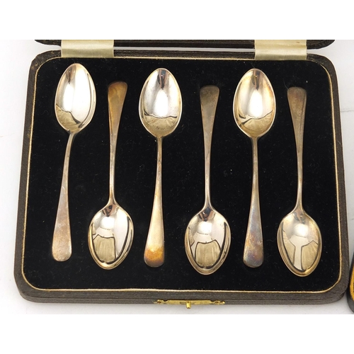 2875 - Two sets of six silver teaspoons one with sugar tongs, Sheffield and Birmingham hallmarks, with fitt... 