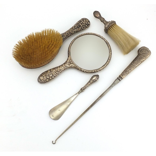 2865 - Victorian and later silver dressing able items including a large button hook, hand mirror and brushe... 