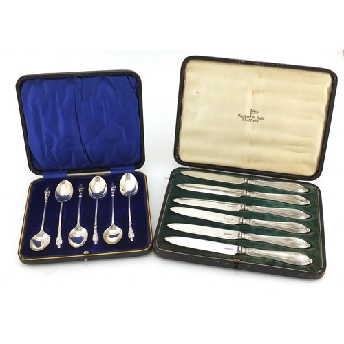 2876 - Set of six silver butter knives and apostle spoons including Walker & Hall, both with fitted cases, ... 