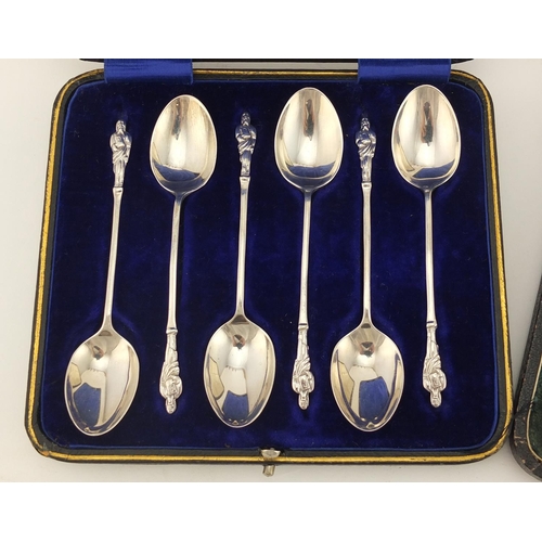 2876 - Set of six silver butter knives and apostle spoons including Walker & Hall, both with fitted cases, ... 