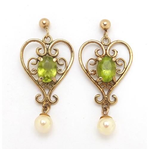3024 - Pair of 9ct gold peridot and simulated pearl love heart earrings, 3cm in length, approximate weight ... 