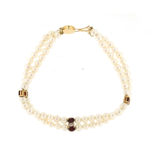 2885 - Two row pearl, garnet and diamond bracelet with 14ct gold clasp, 17cm in length, approximate weight ... 