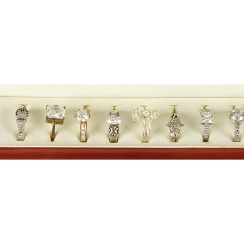 3003 - Twelve silver cubic zirconia and clear stone rings, housed in a ring display box, various sizes, app... 